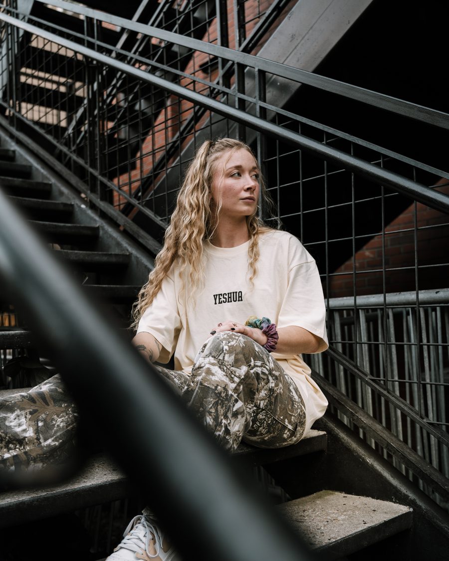Archangel Streetwear, seated on stairs